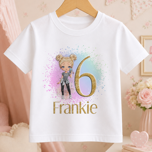 A white t-shirt with a graphic design featuring a cartoon girl and the number 6, along with the text "Frankie" below the number.