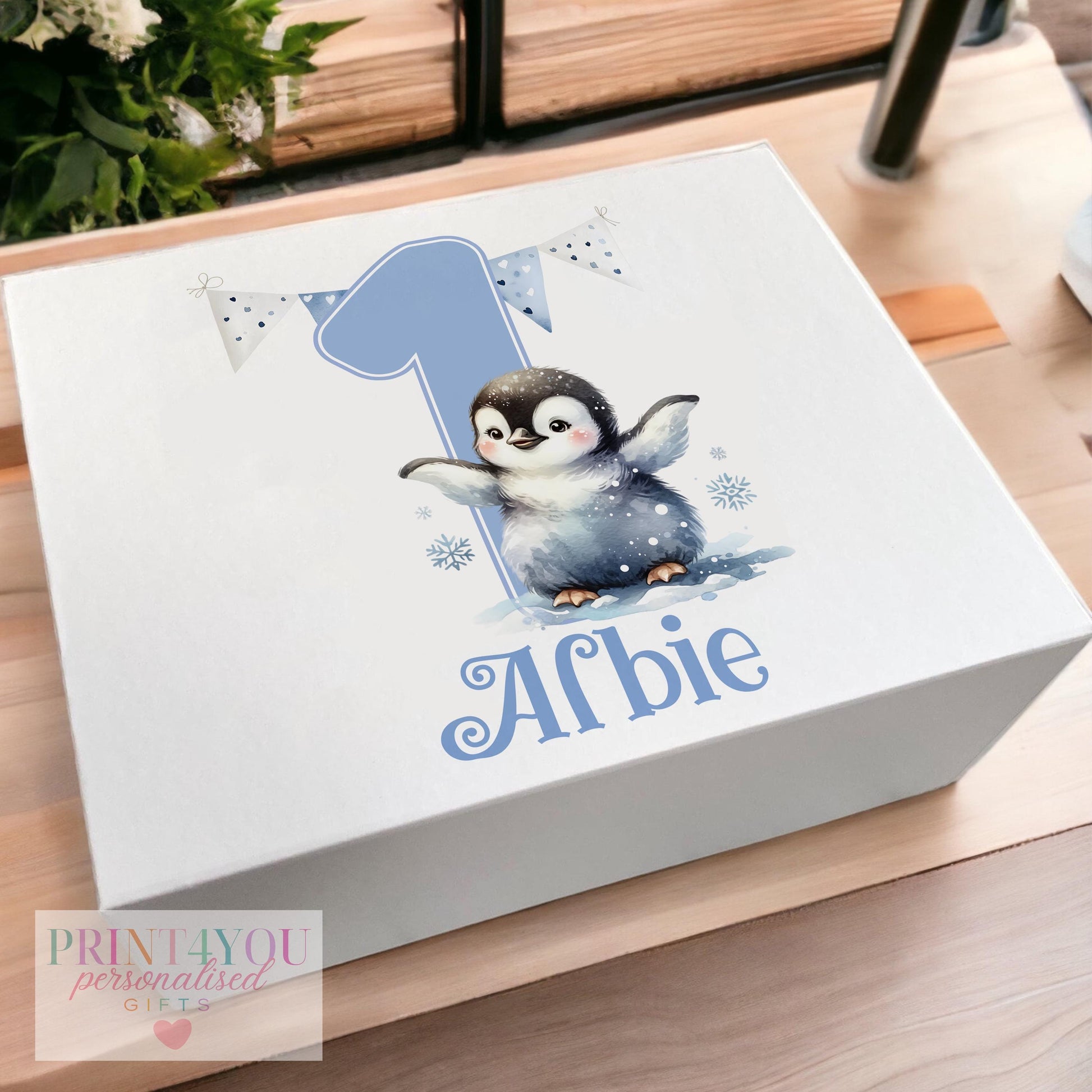 White magnetic keepsake box personalised with a baby's name and a blue penguin design