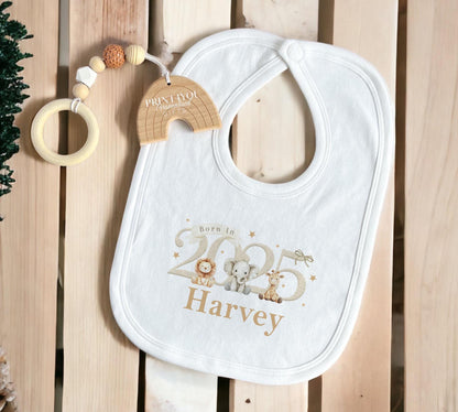 Close-up of the personalised 'Born in 2025' safari vest showing the baby's name detail.