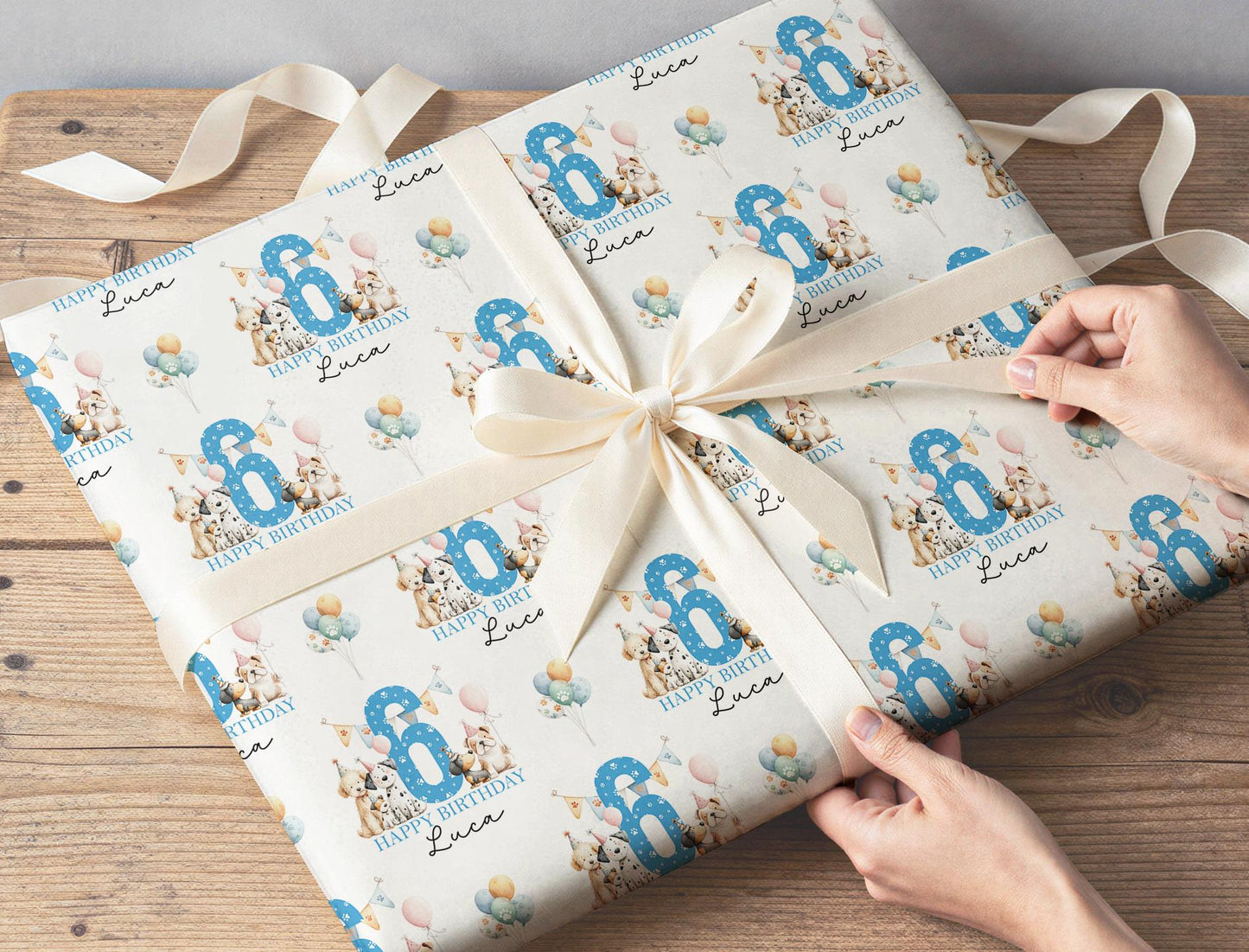 Personalised dog birthday wrapping paper wrapped around a gift box