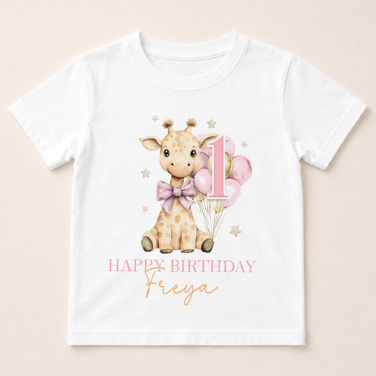 A white t-shirt with a giraffe and balloons printed on it, along with the text "Happy Birthday Freya".