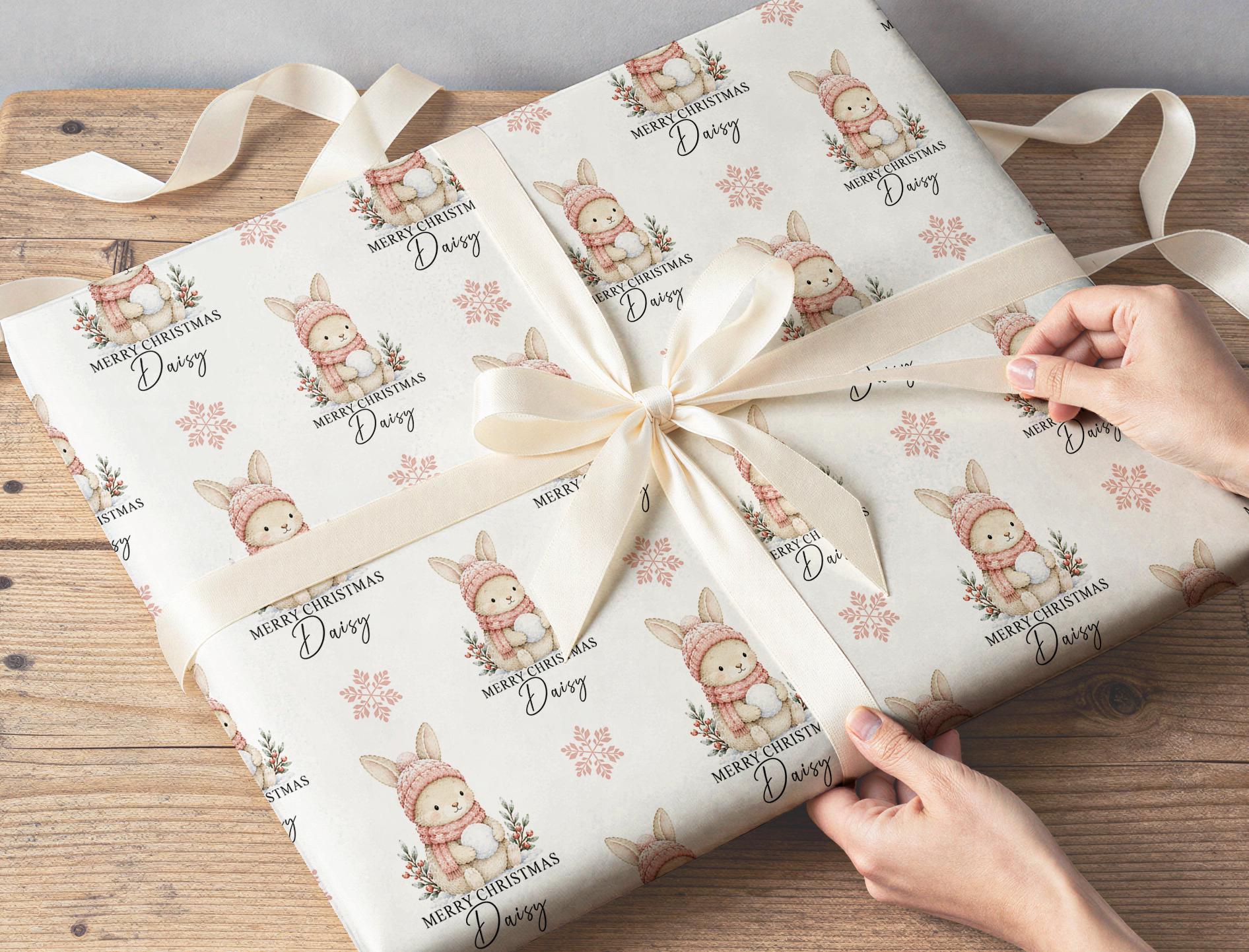Personalised bunny rabbit gift wrap roll flat lay showing the full soft festive pattern