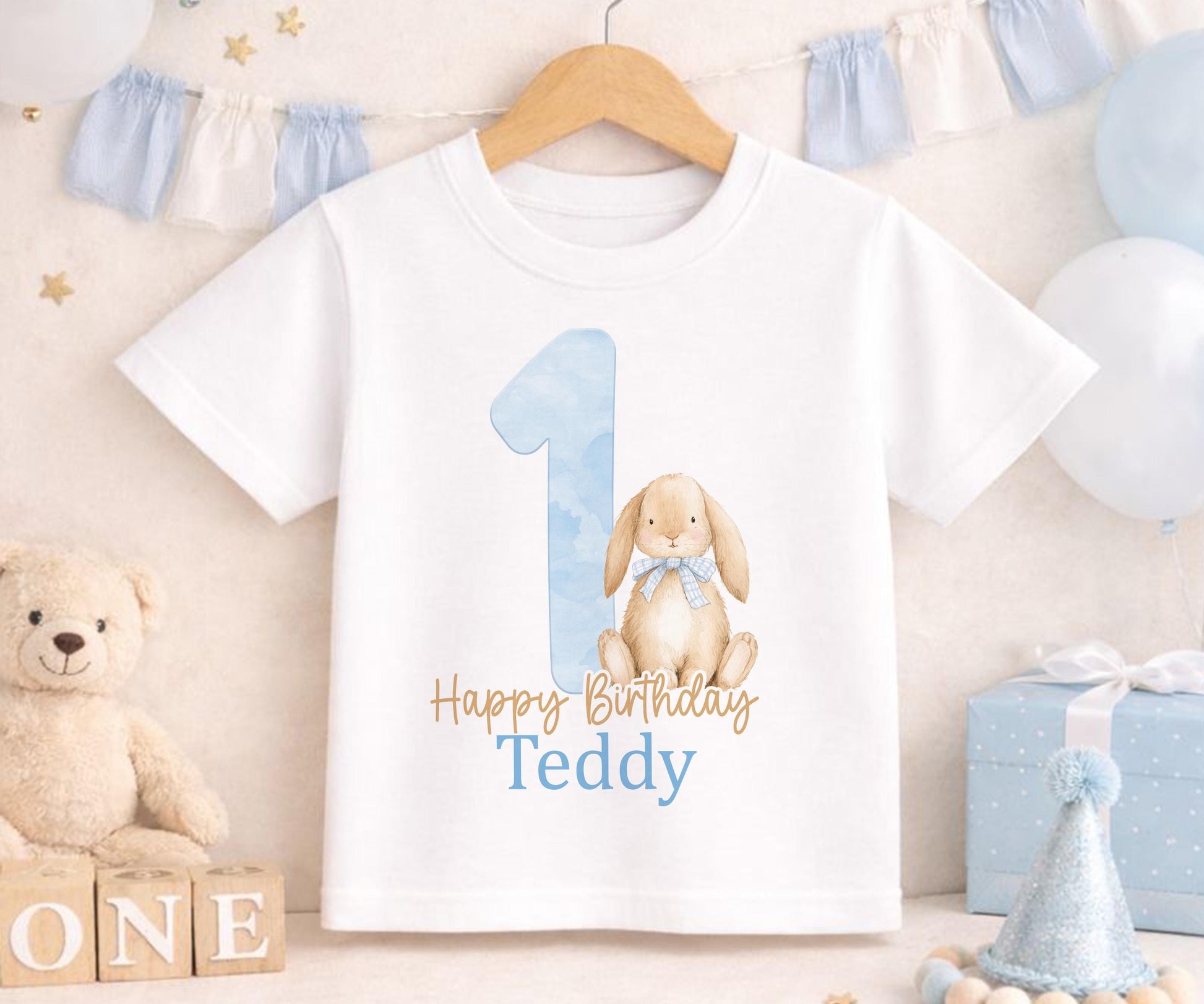 Personalised blue bunny first birthday vest with custom name printed on soft cotton