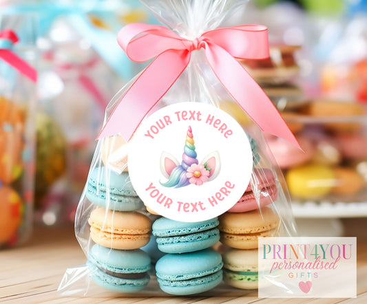 Strip of three personalised unicorn horn birthday stickers in shiny white gloss, each 5cm