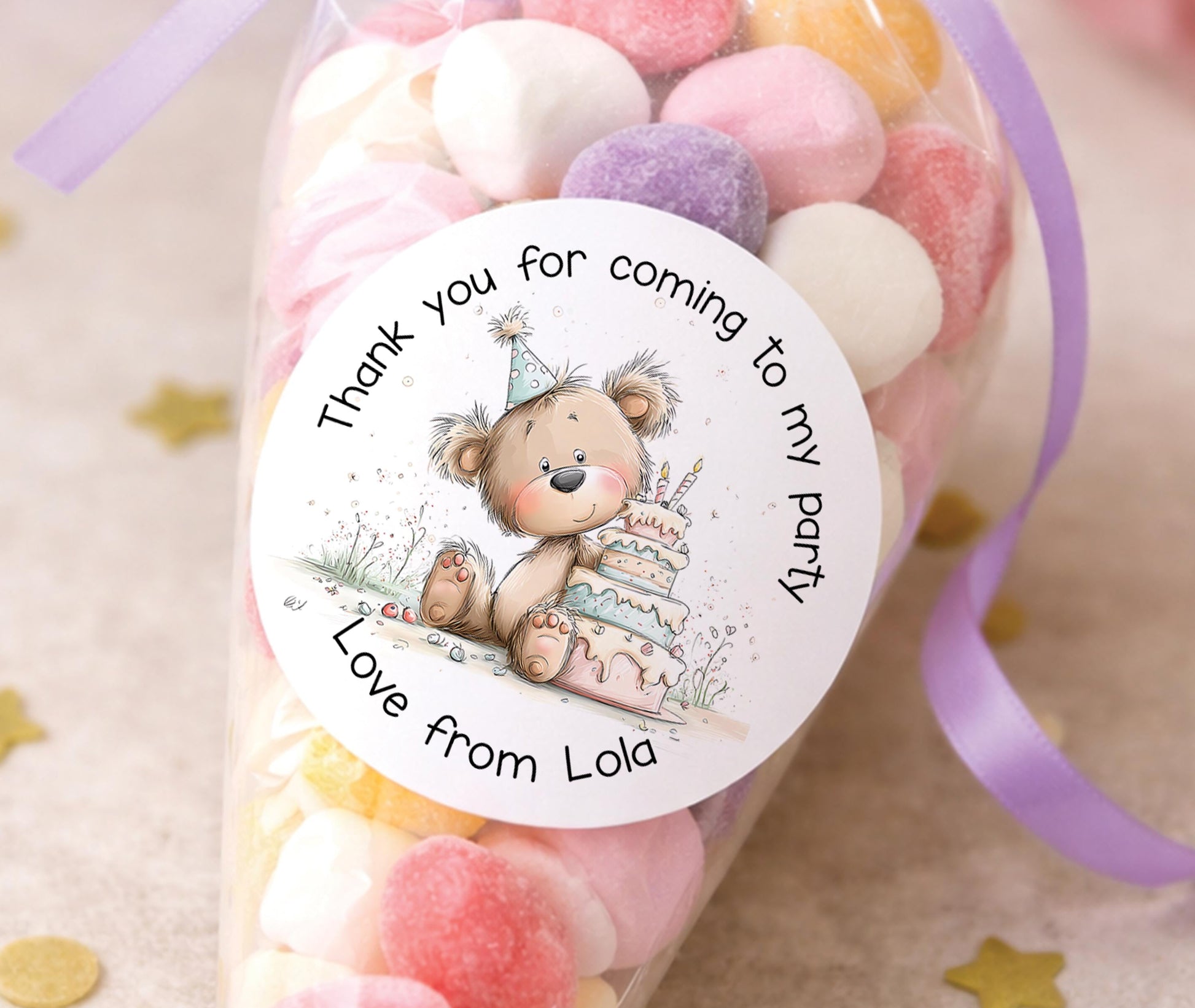 Glossy round personalised teddy bear stickers, printed with a child's name for birthday party bags and favours
