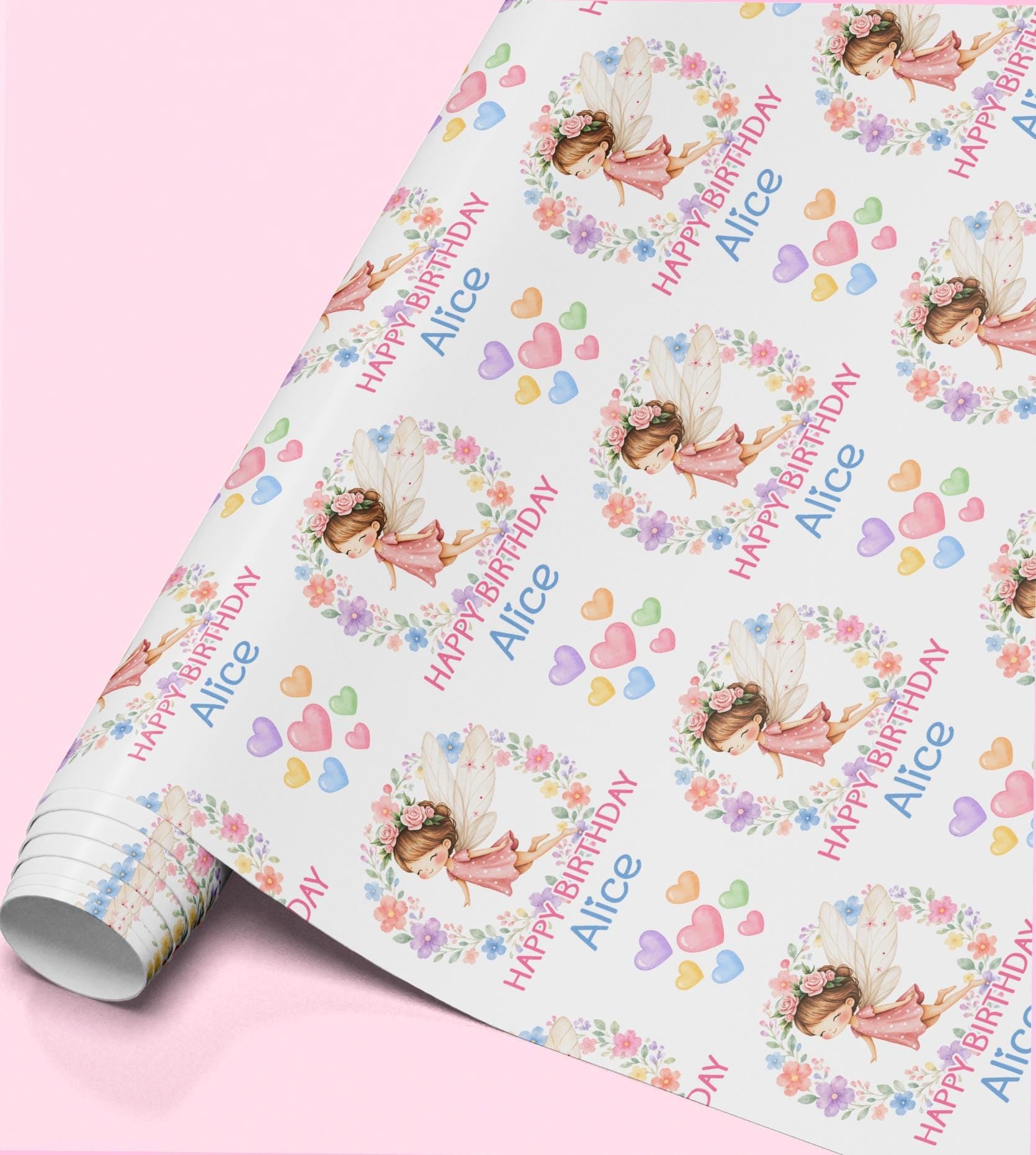 Personalised fairy birthday wrapping paper featuring a pretty fairy in a floral wreath, pastel hearts and custom name for girls.