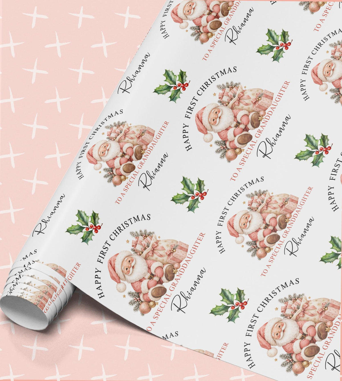 Personalised baby first Christmas wrapping paper in pink with a sleeping baby Santa, holly and Happy First Christmas with relation and name