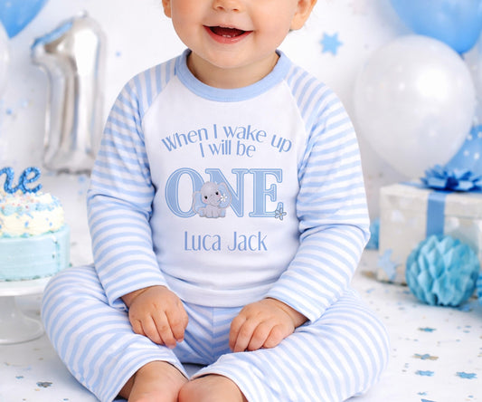 Personalised first birthday pyjamas with blue elephant design and custom name, soft cotton