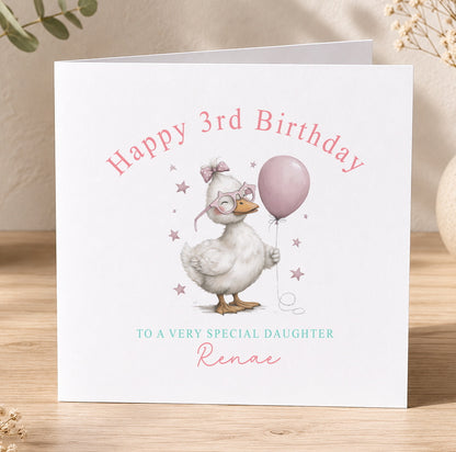 Personalised birthday card featuring a cartoon pink duck wearing glasses and holding a balloon, with space for a custom name, age and relation