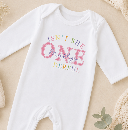 Personalised baby onesie printed with the phrase 'Isn't she ONE-derful' and the child's name