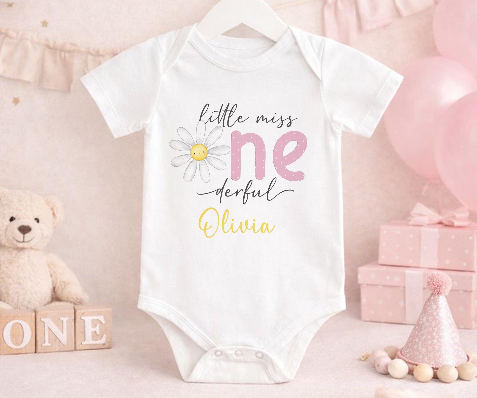 Personalised first birthday vest with daisy party design and custom name, soft cotton.