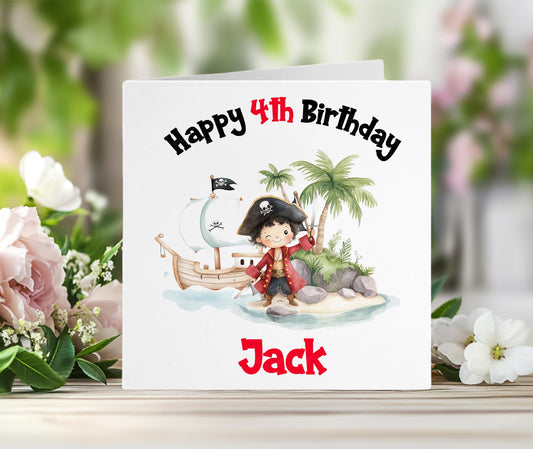 Personalised pirate birthday card with a colourful pirate ship and island scene, and the child's custom name printed in red on the front