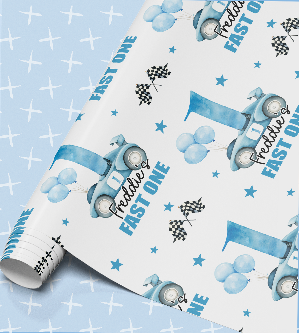 a roll of wrapping paper with a blue and white design, including a car, balloons, and stars. The text "FAST ONE" is visible, suggesting the paper is intended for a birthday celebration.