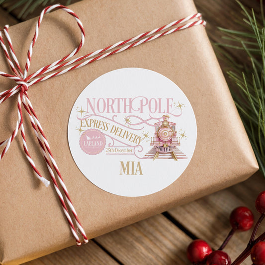 A brown gift box wrapped with red and white twine, featuring a label that reads "NORTHPOPL[E]L[A]D[Y]" and "EXPRESS DELIVERY" along with "LA[PLAND]" and "25th December".