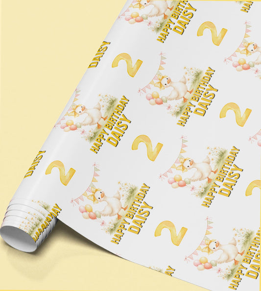 Roll of personalised yellow duck and balloon birthday wrapping paper printed with the name Daisy and a Happy Birthday message.