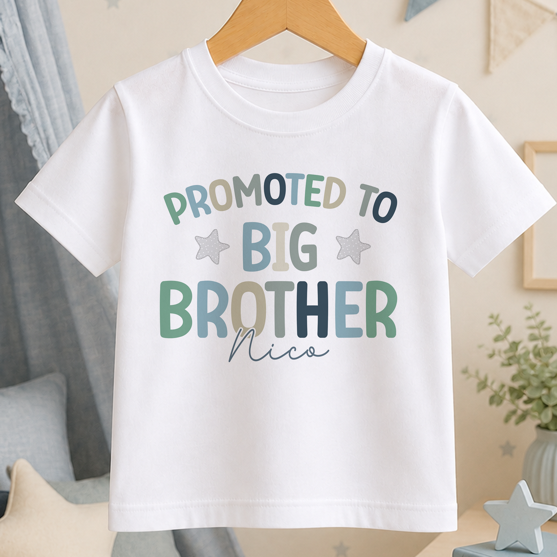 A white t-shirt with text that says "PROMOTED TO BIG BROTHER NICO" printed on it.