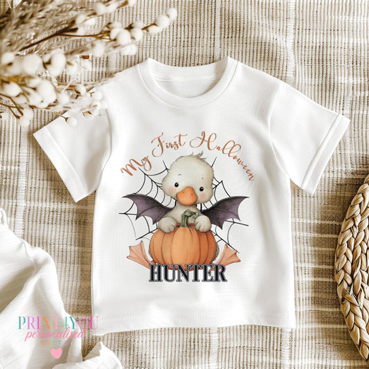 Personalised first Halloween baby outfit with pumpkin and duck design, flat lay of full set