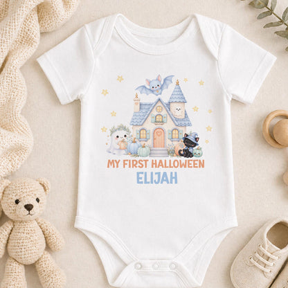 Personalised baby first Halloween vest printed with a pastel haunted house, ghost, black kitten wizard, bat and pumpkins, finished with the baby's name.