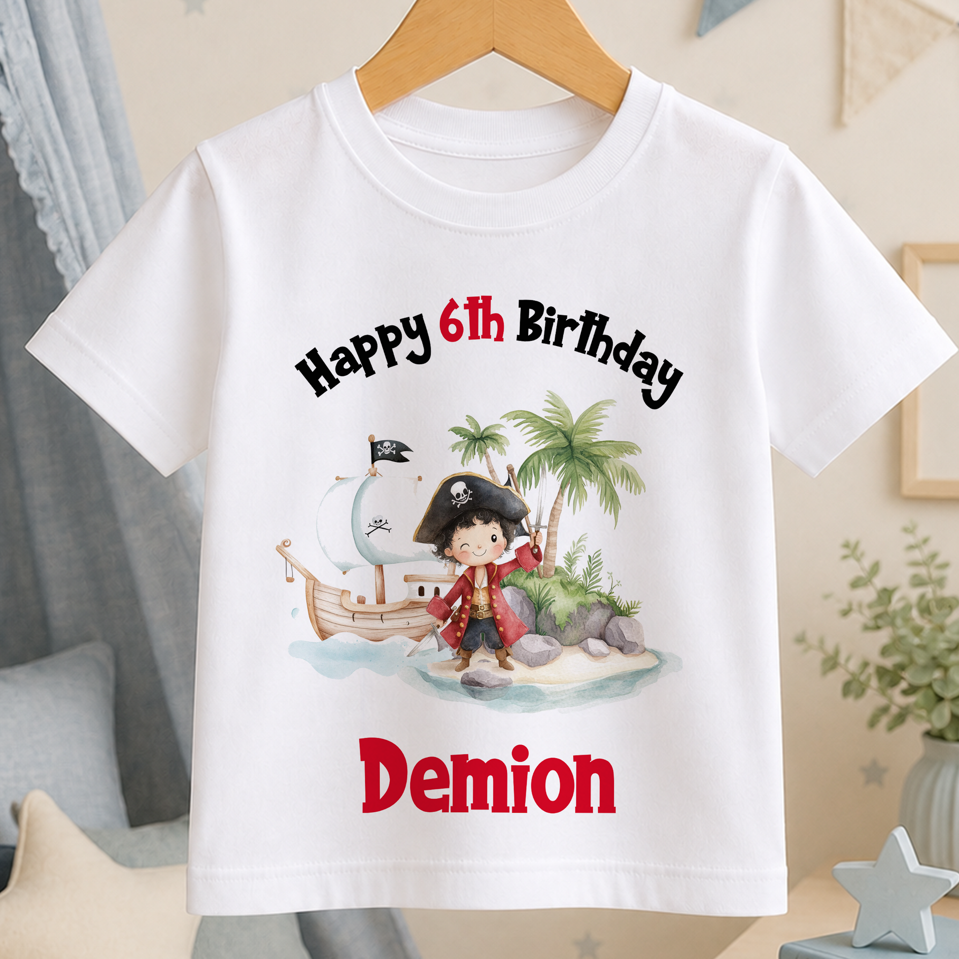 A white t-shirt with a pirate-themed graphic and text, celebrating the 6th birthday of a child named Demion.