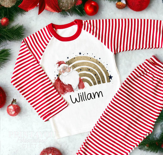 Personalised Santa rainbow Christmas pyjamas with a child's name on red and white striped nightwear
