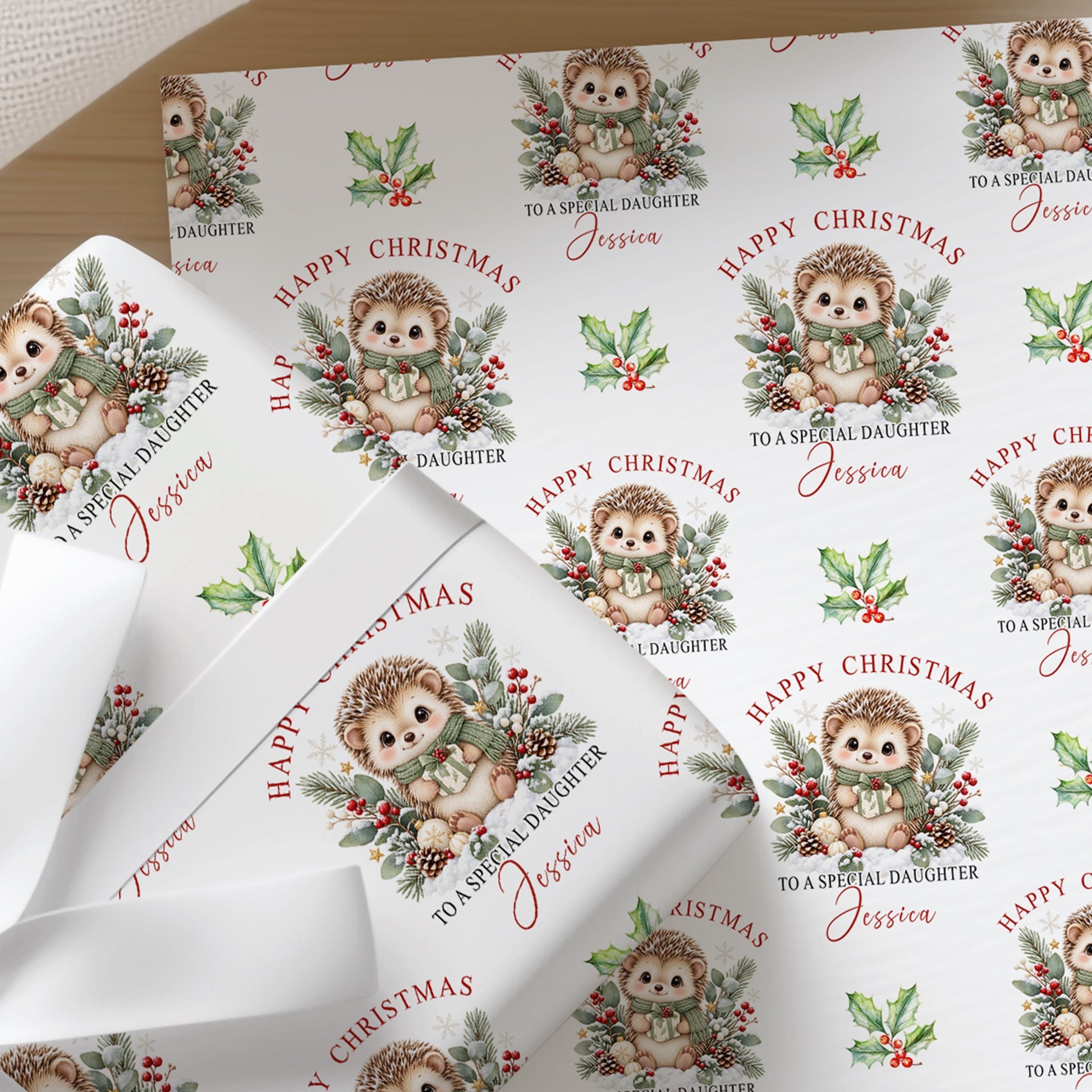 Sheets of the personalised hedgehog Christmas wrapping paper