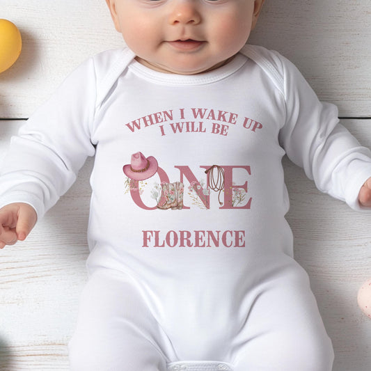 Personalised pink cowgirl first rodeo bib, printed with your baby's name and western cactus design.
