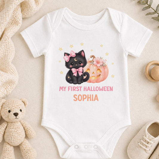Personalised baby’s first Halloween white vest featuring a cute black kitten with pink bows, a peach pumpkin and stars.