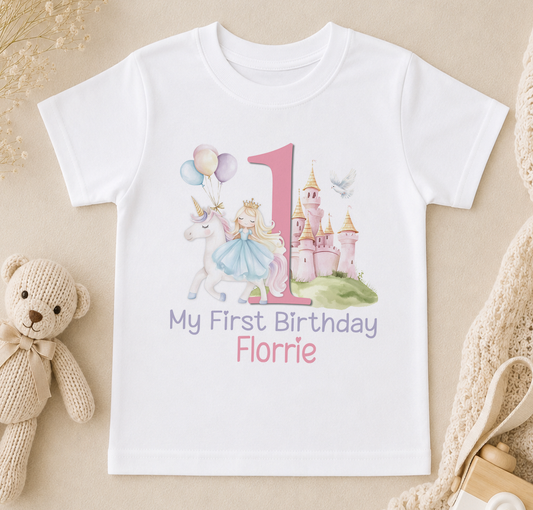 A white t-shirt with a princess and castle design, along with the text "My First Birthday Florrie".