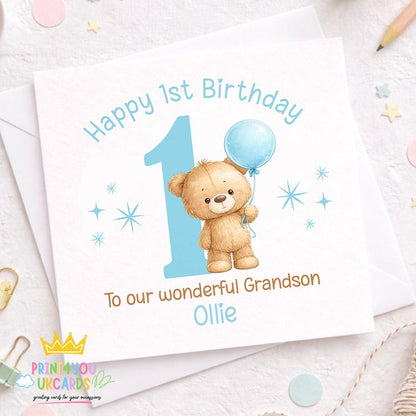 Front view of the square 1st birthday card for boys, shown ready for personalising with the child's name and relation.