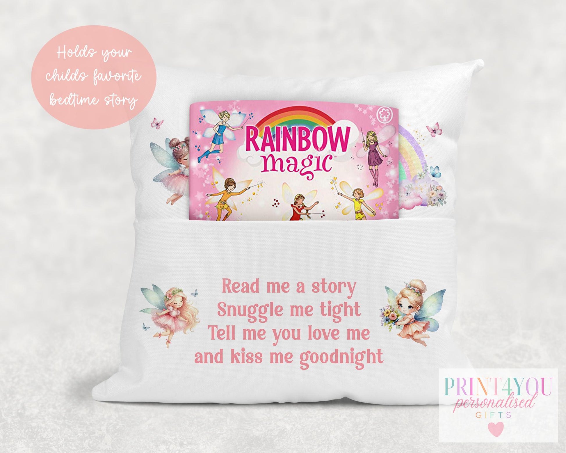 Personalised fairy rainbow book cushion styled on a child's bed