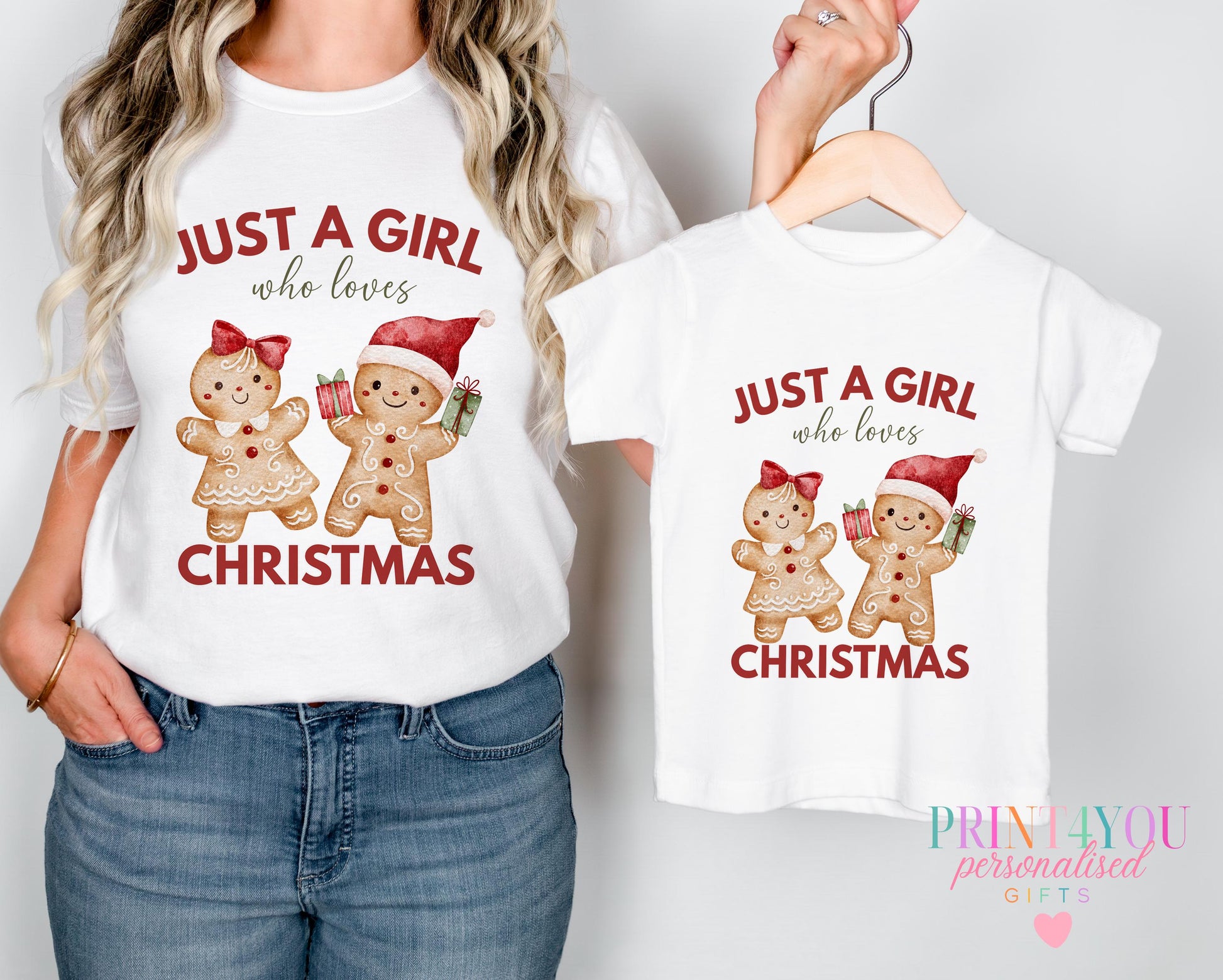Mother and daughter wearing matching "Just a Girl Who Loves Christmas" personalised t-shirts with a gingerbread couple design