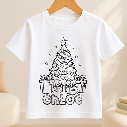 A white t-shirt with a black and white illustration of a Christmas tree and presents, along with the name "Chloe" written below it.