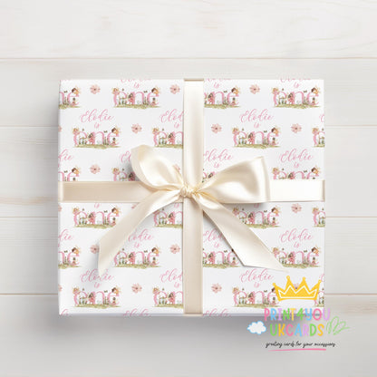 Gift wrapped in the personalised pink fairy wrapping paper, tied with ribbon.