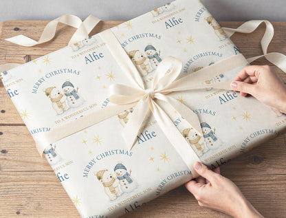 Personalised polar bear and snowman wrapping paper roll shown with custom name example