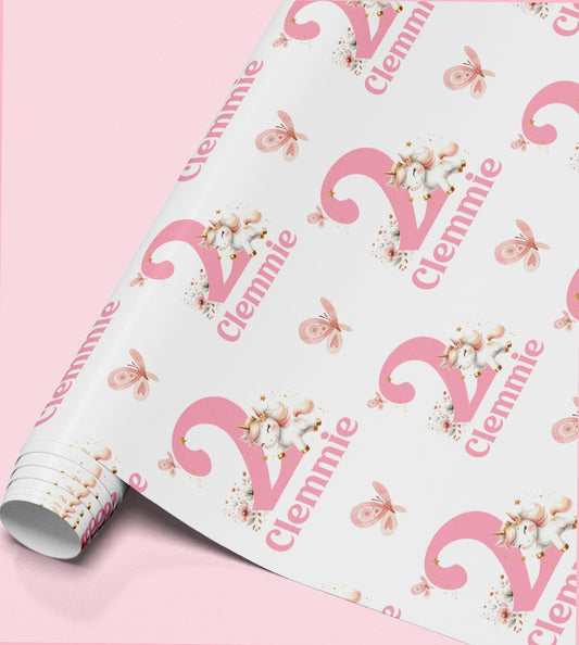 Pink and white unicorn wrapping paper personalised with the name 'Clennie', repeated across the pattern with butterflies
