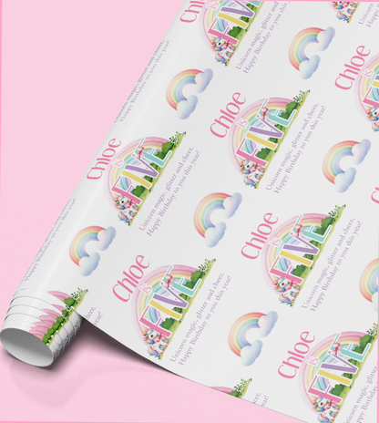 Personalised rainbow unicorn wrapping paper design shown with a sample name and age