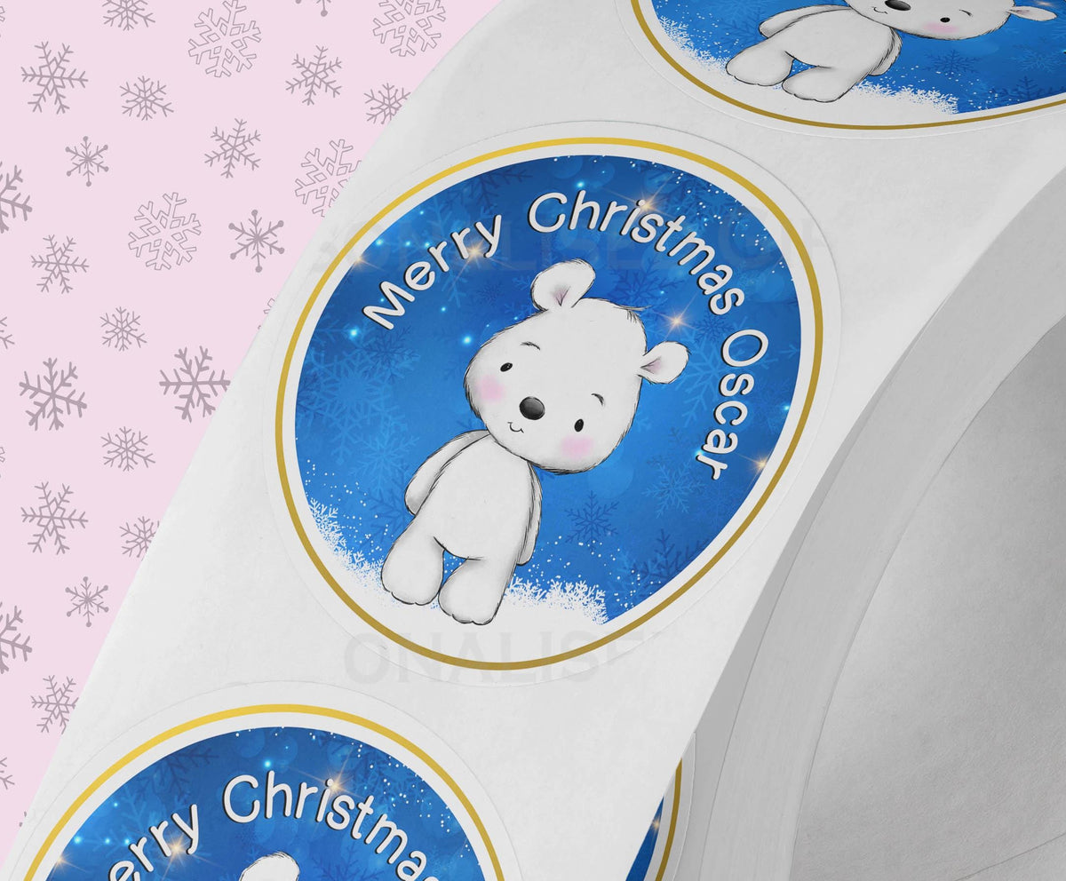 Strip of personalised glossy Father Christmas gift stickers, each printed with a custom name