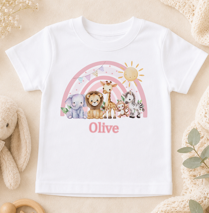 A white t-shirt with a colorful graphic design featuring various animals, including a lion, giraffe, zebra, and elephant, along with a rainbow and a sun. The word "Olive" is written below the design.