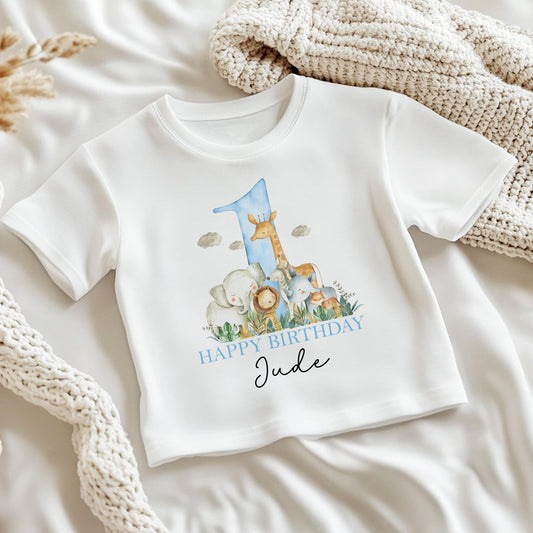 Personalised safari animals first birthday bib featuring a giraffe, elephants and lion, printed with your baby's name.