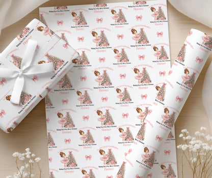 Close up of the ballerina Christmas gift wrap showing the repeated pink design