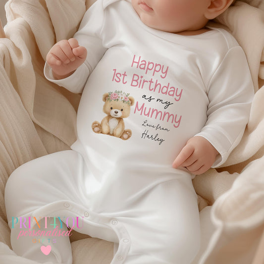Personalised 'Happy 1st Birthday as my Mummy' sleepsuit with a teddy bear in a flower crown and custom name.