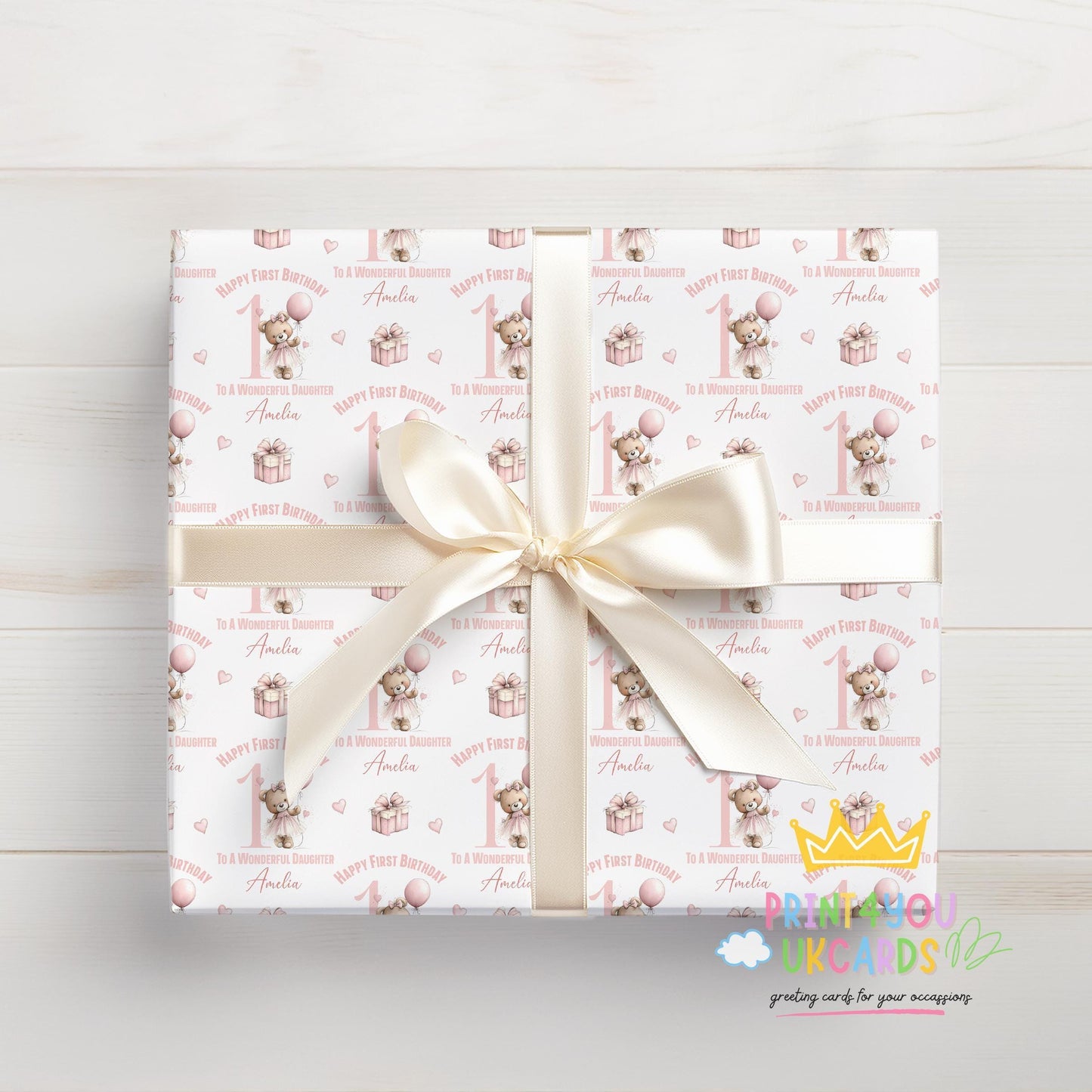Roll of the personalised pink ballerina teddy bear wrapping paper packaged ready for postal delivery.