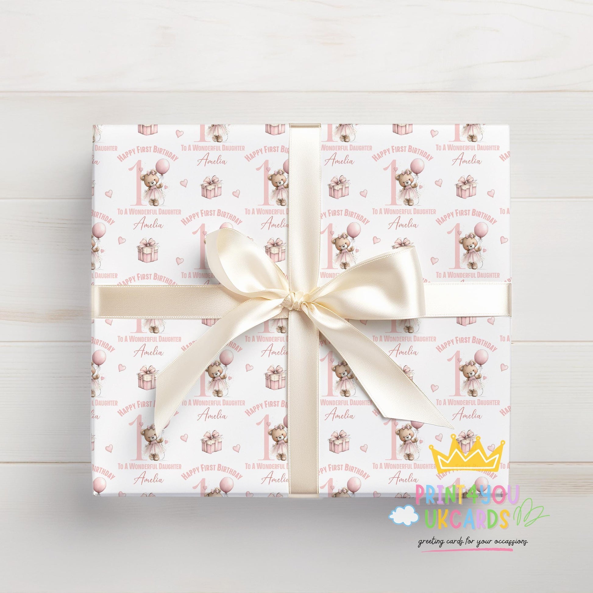 Roll of the personalised pink ballerina teddy bear wrapping paper packaged ready for postal delivery.