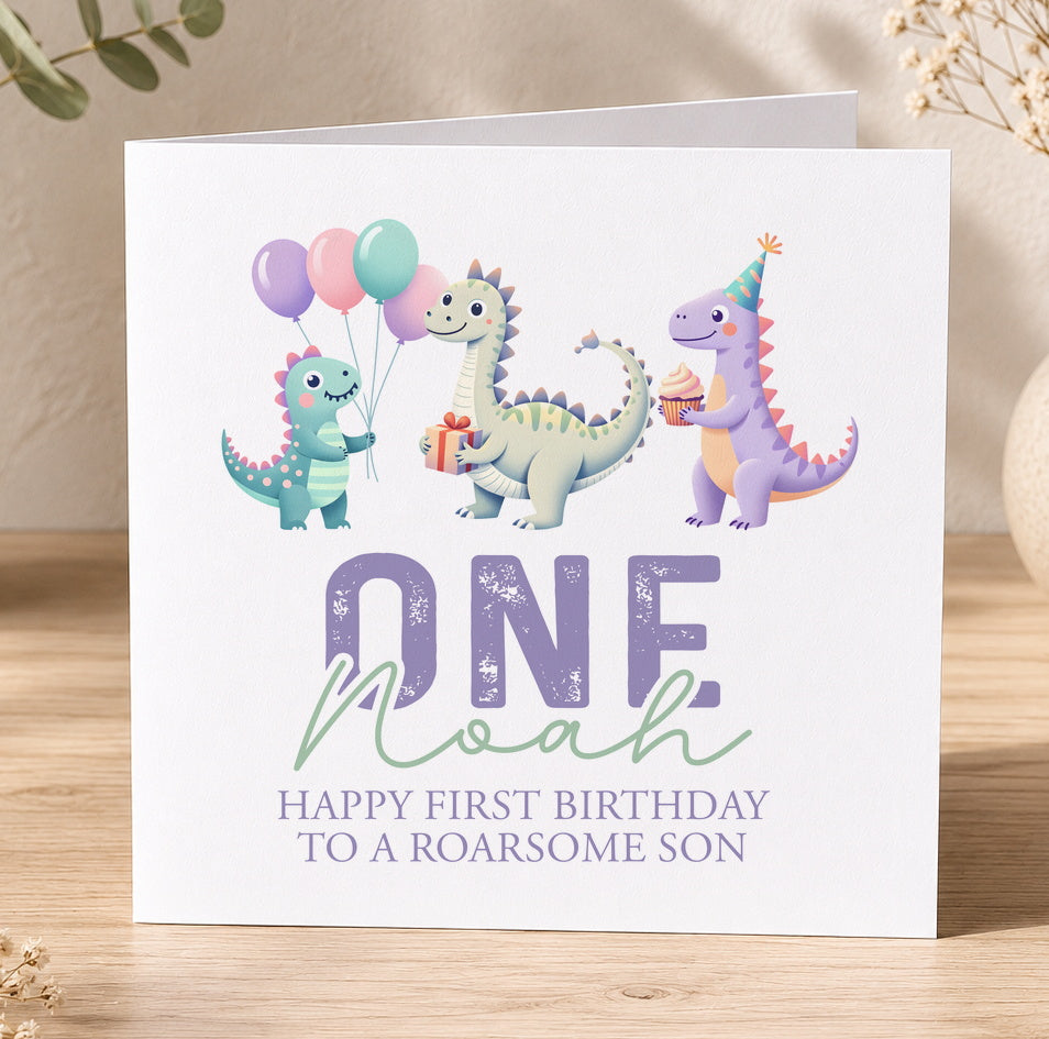 Dinosaur first birthday card personalised with the name Noah, featuring three dinosaurs and balloons