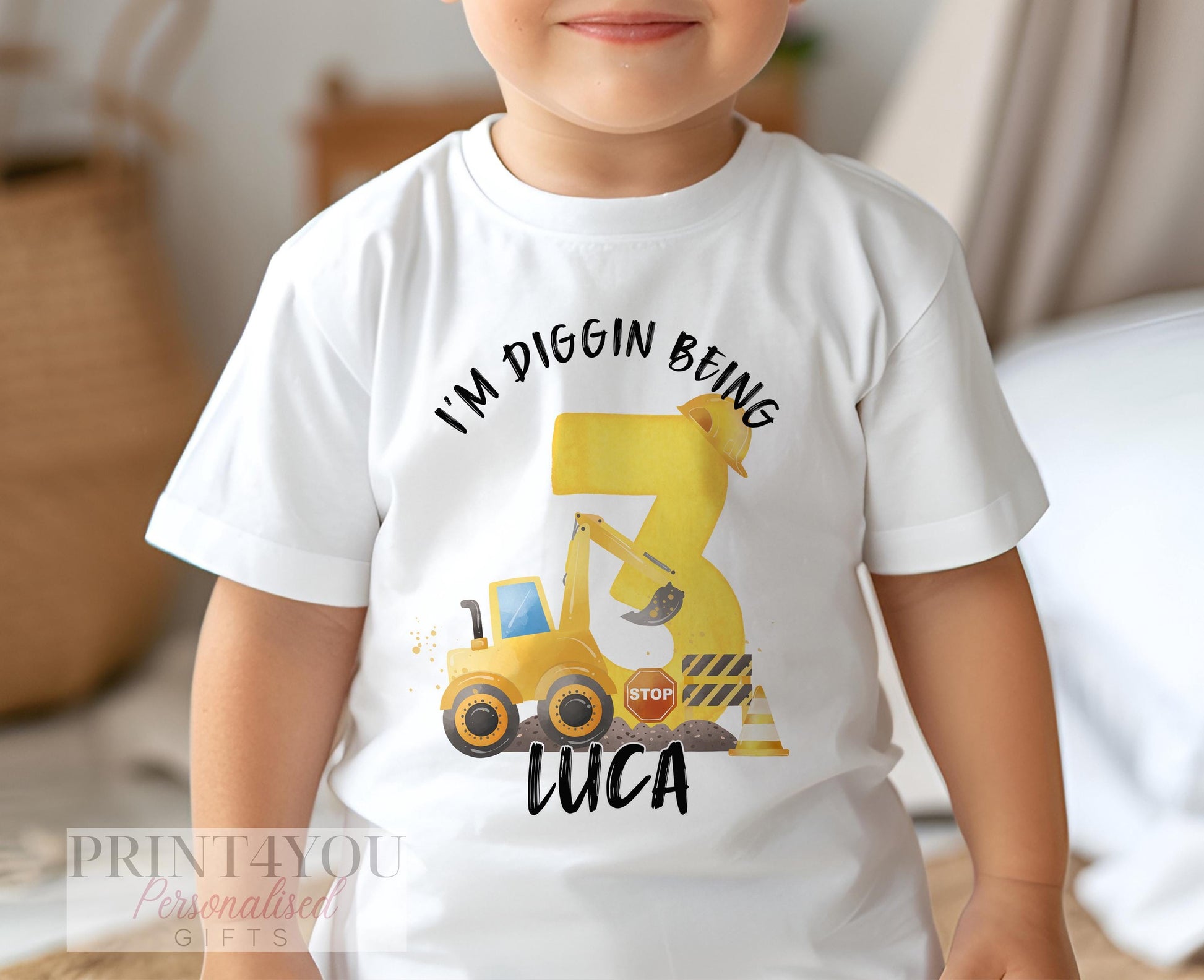 Child wearing personalised white construction digger birthday t-shirt