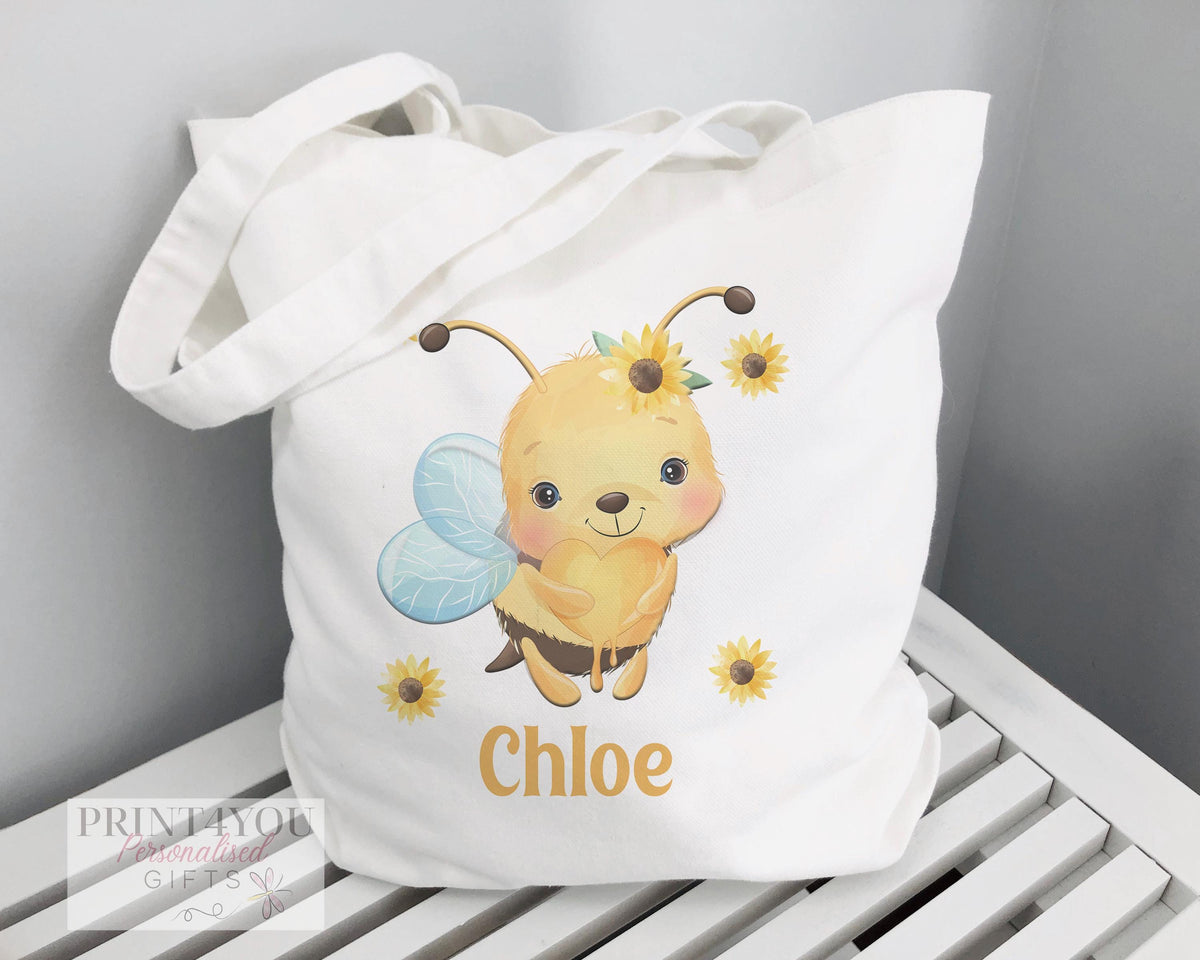 White cotton tote bag printed with a Highland cow design, non-personalised shopper