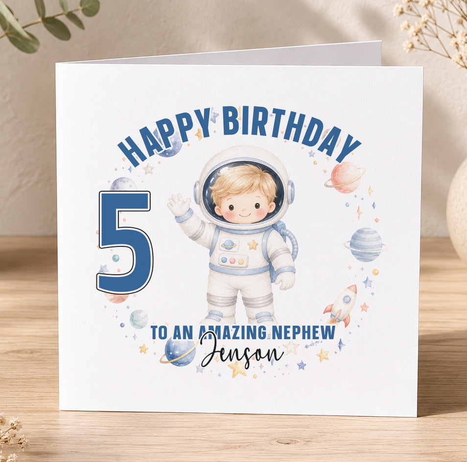 A personalised birthday card featuring a young boy in a spacesuit illustration, with the number 5 and the message 'Happy Birthday to an amazing nephew Jenessan'.
