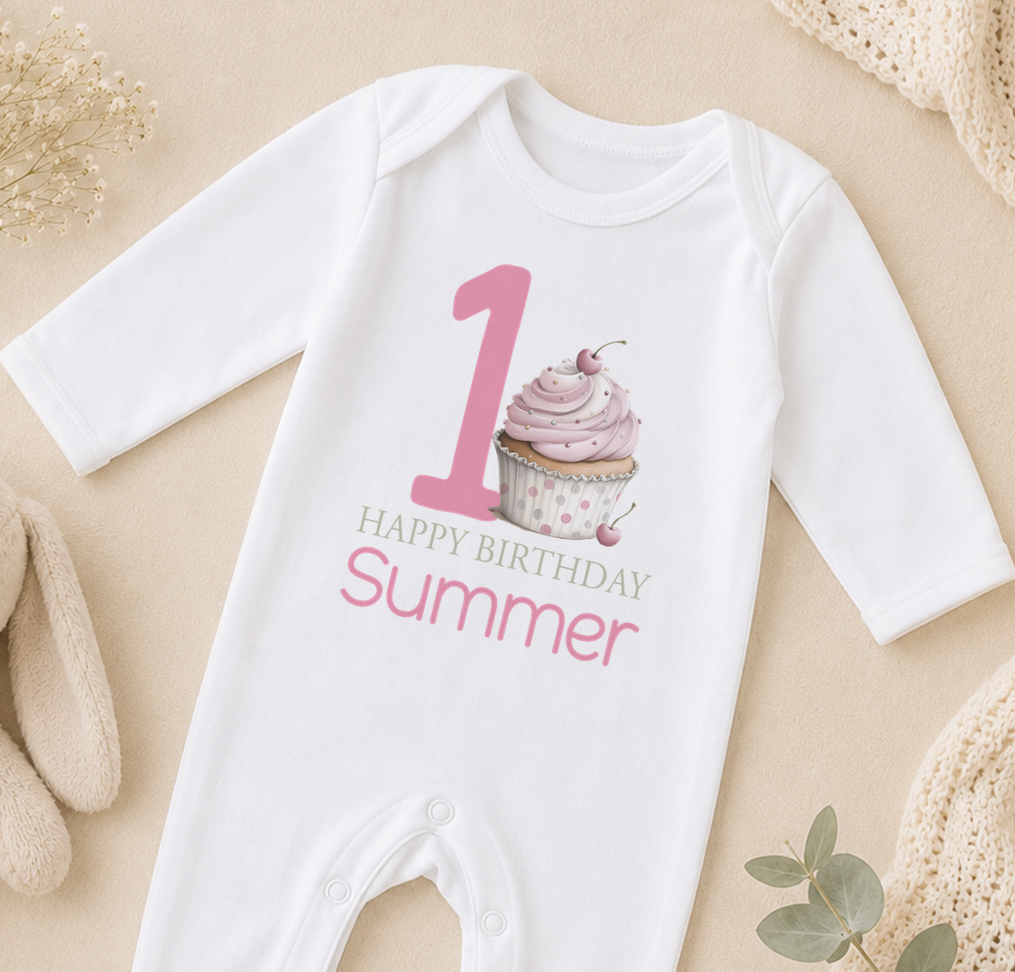 A white onesie with a pink cupcake and the text "Happy Birthday Summer" printed on it.