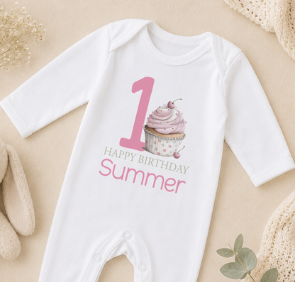 A white onesie with a pink cupcake and the text "Happy Birthday Summer" printed on it.