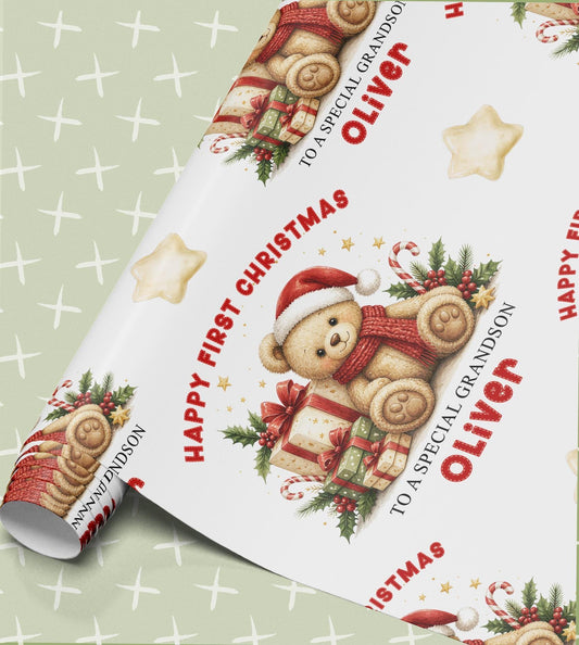 Personalised baby first Christmas wrapping paper, part-rolled sheet printed with teddy bears, presents and Happy First Christmas with a name